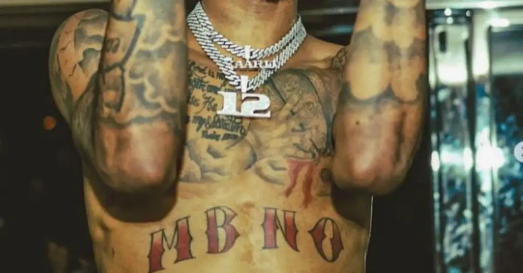 ja morant tattoos on his chest and hands