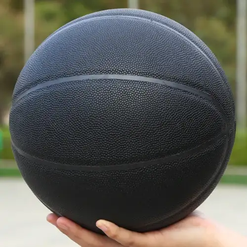 Black Basketball in hand